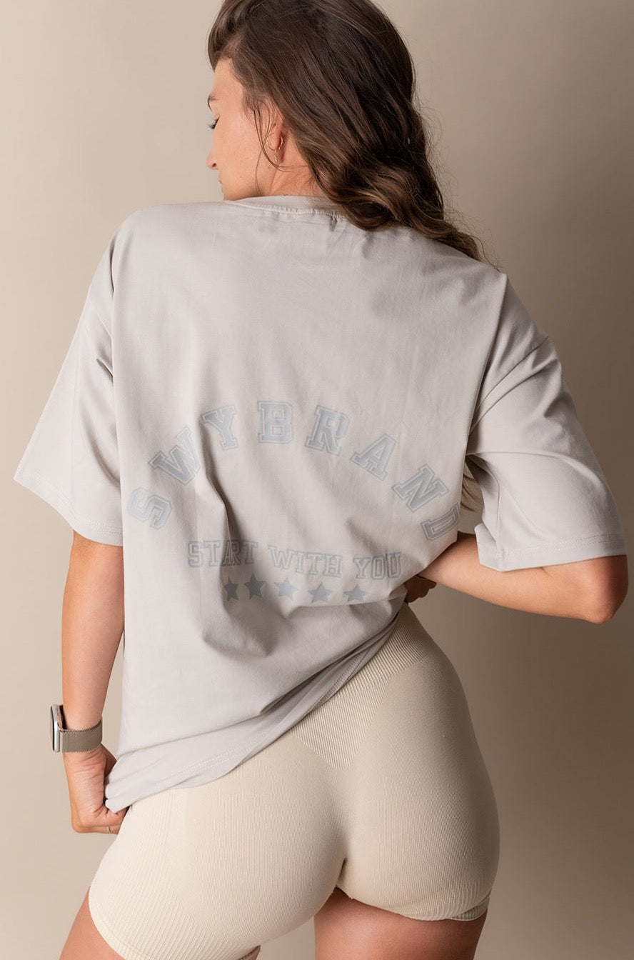 An oversized t-shirt from Swybrand in gray color with a big logo comfortable material for everyday use